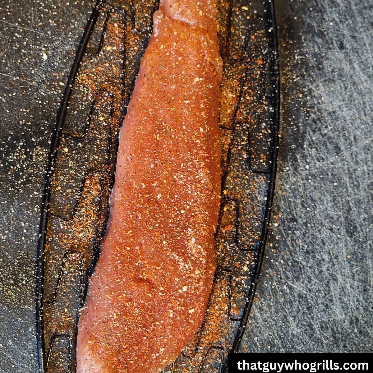 Salmon fillet on fish basket seasoned with seasoning