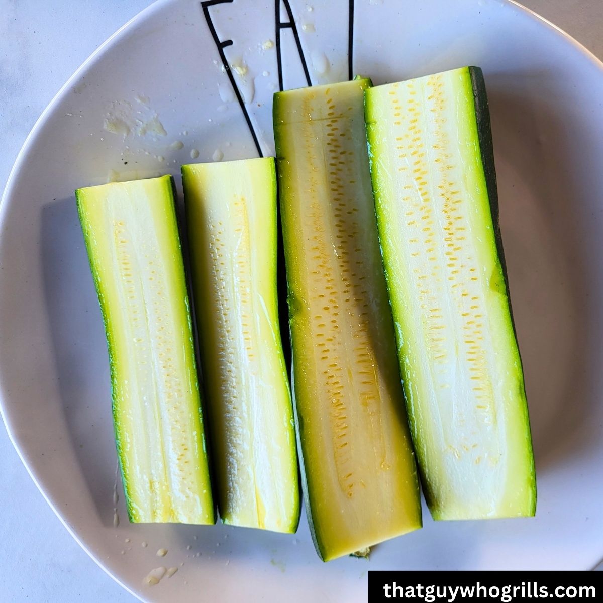 Zucchini sliced before seasoning and grilling