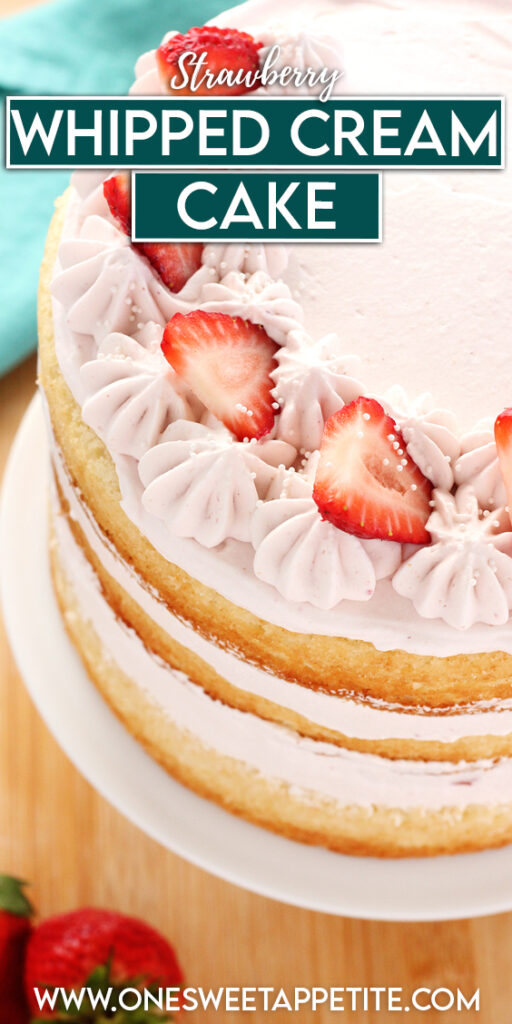 angled top down image showing a three layer white cake that is filled with pink whipped cream and topped with strawberry slices. The cake is sitting on a white cake stand with fresh strawberries scattered around on a wooden table. TExt overlay reads "strawberry whipped cream cake"