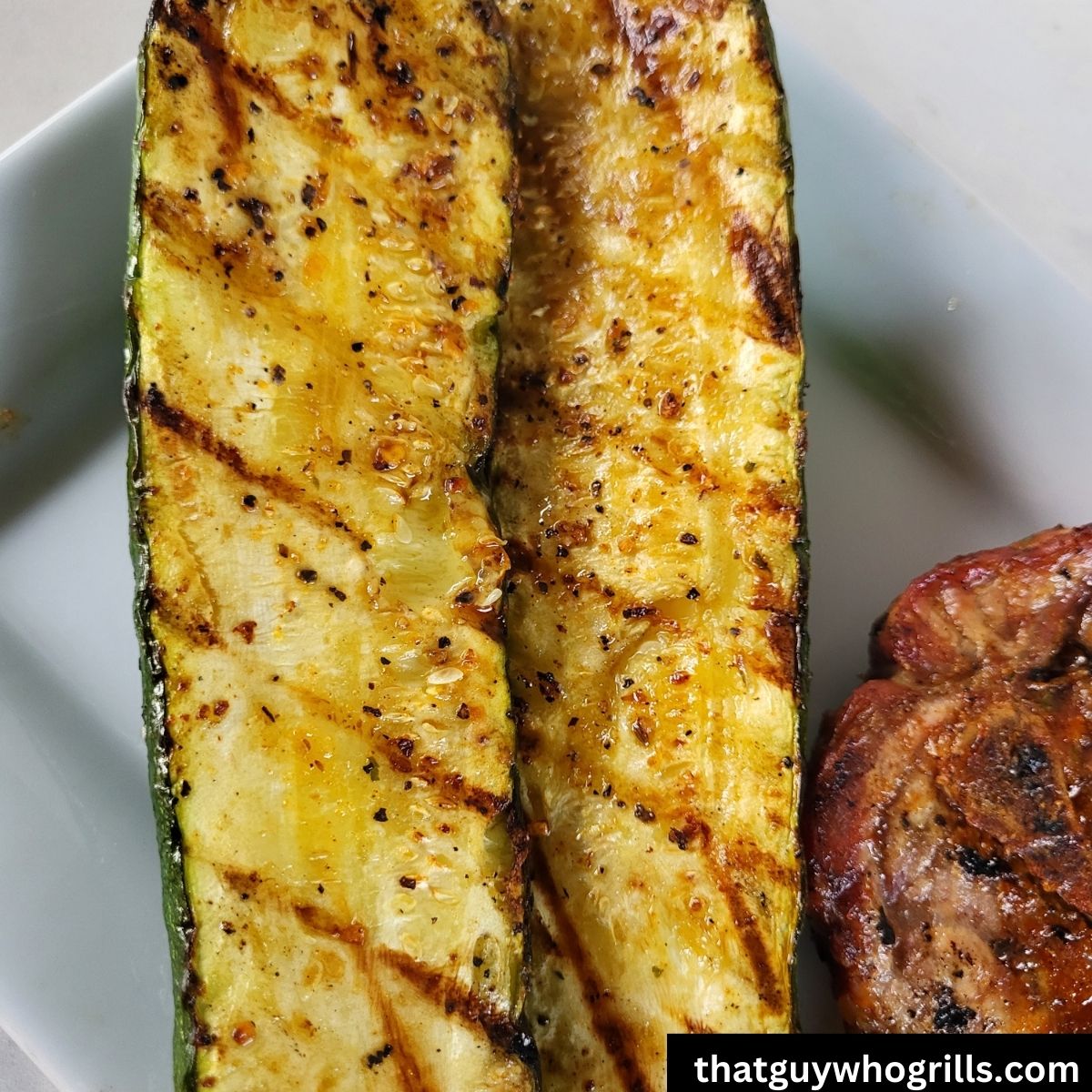 Grilled Zucchini on white plate